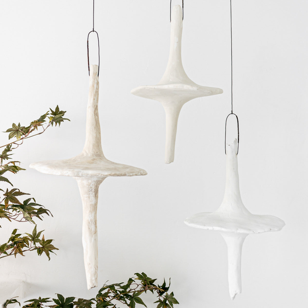 These representational fungi are handmade from paper clay, plaster, paint and wire. Jennifer Alden Design one-of-a-kind contemporary hanging sculpture.