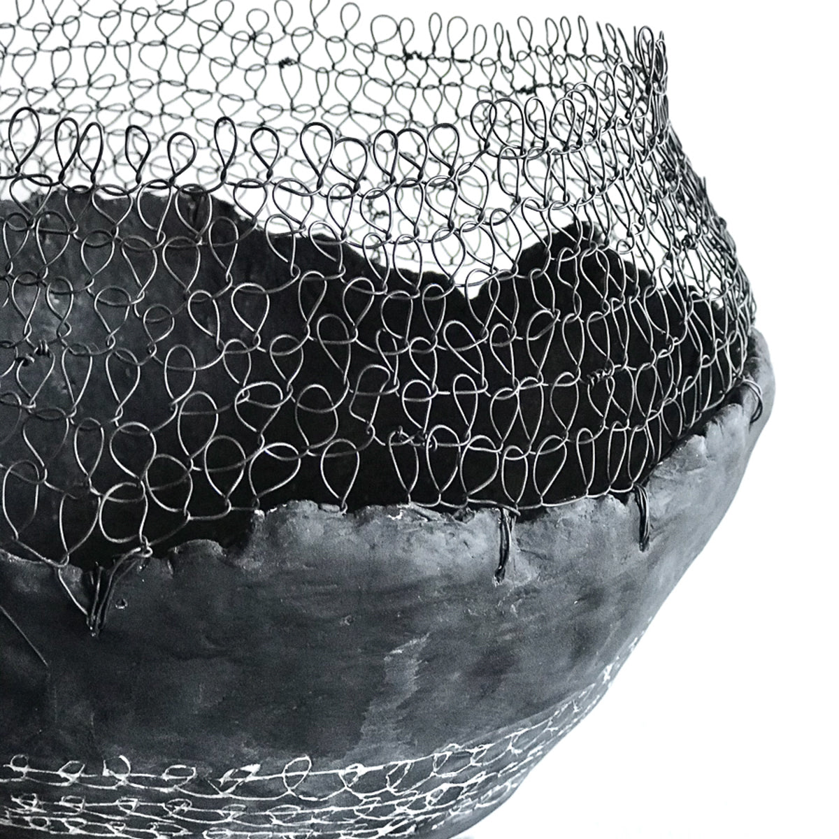 Handmade by artist Jennifer Alden Design, Vessel Study No. 39 is a contemporary sculpture made from paper clay, plaster, paint and wire. Each vessel in this collection is one-of-a-kind, rare, and both primitive and modern. Close-up image of wire looping.
