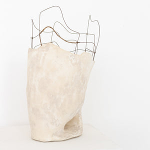 Handmade by artist Jennifer Alden Design, Vessel Study No. 44 is a contemporary sculpture made from paper clay, plaster, paint and wire. This sculpture is designed for tabletop or floor placement. Each unique vessel in this collection is one-of-a-kind, rare, and both primitive and modern. Side angle image.