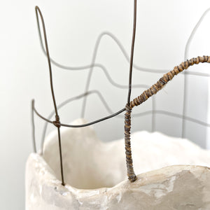 Handmade by artist Jennifer Alden Design, Vessel Study No. 44 is a contemporary sculpture made from paper clay, plaster, paint and wire. This sculpture is designed for tabletop or floor placement. Each unique vessel in this collection is one-of-a-kind, rare, and both primitive and modern. Close-up of wire detail.